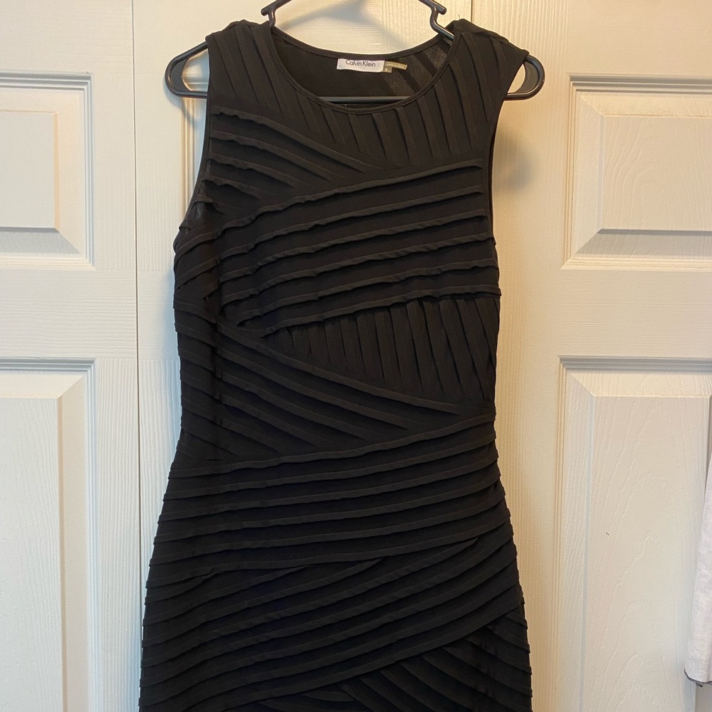 Pre-loved excellent condition beautiful black bodycon dress. Size 8.